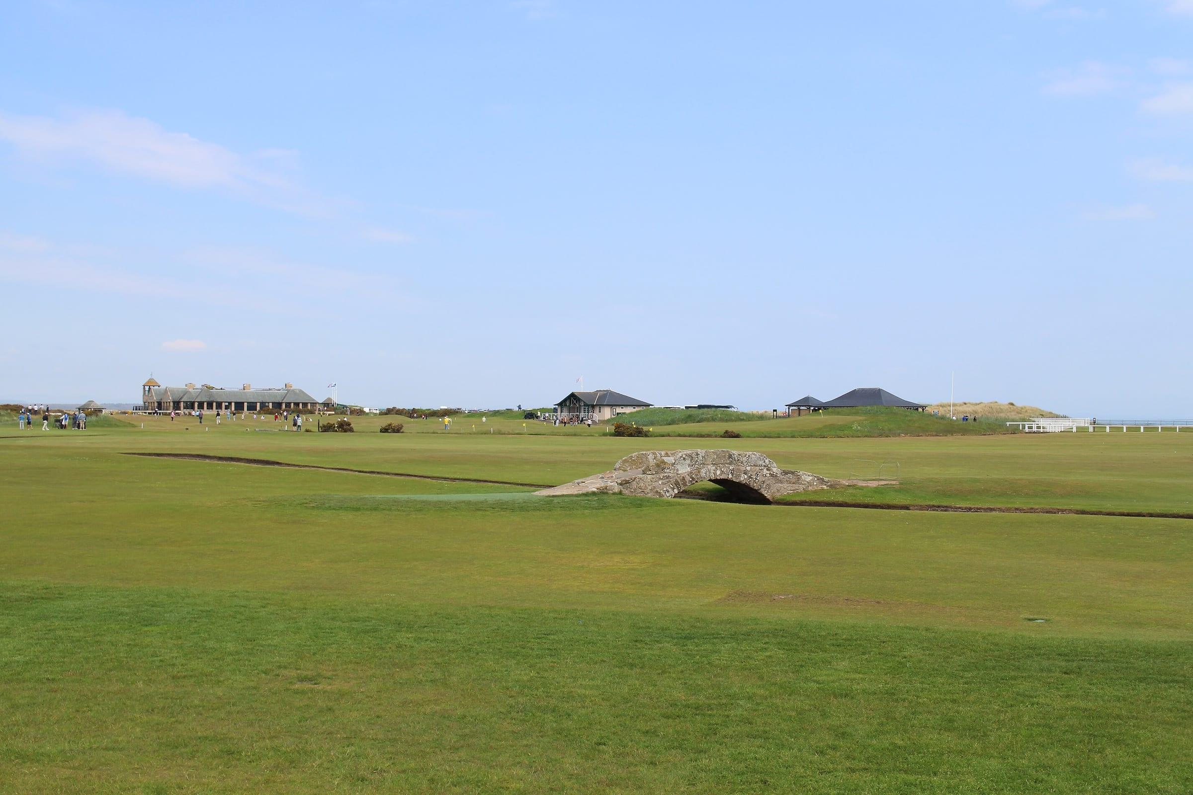 The links at St Andrews, a revetted bunker in the fairway and the clubhouse low on the skyline.
